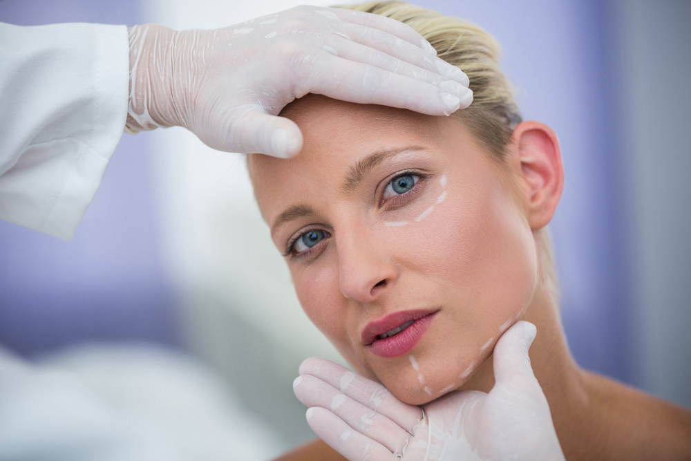 doctor-examining-female-patients-face-cosmetic-treatment